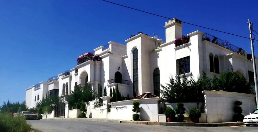 Stone-clad villa compound