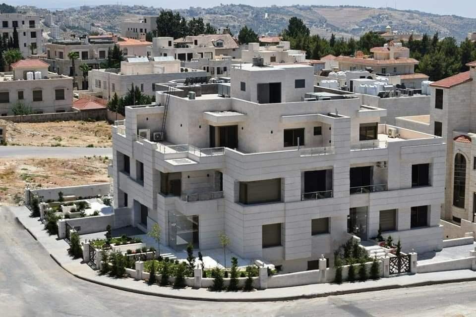 Aerial view of a stone-clad building