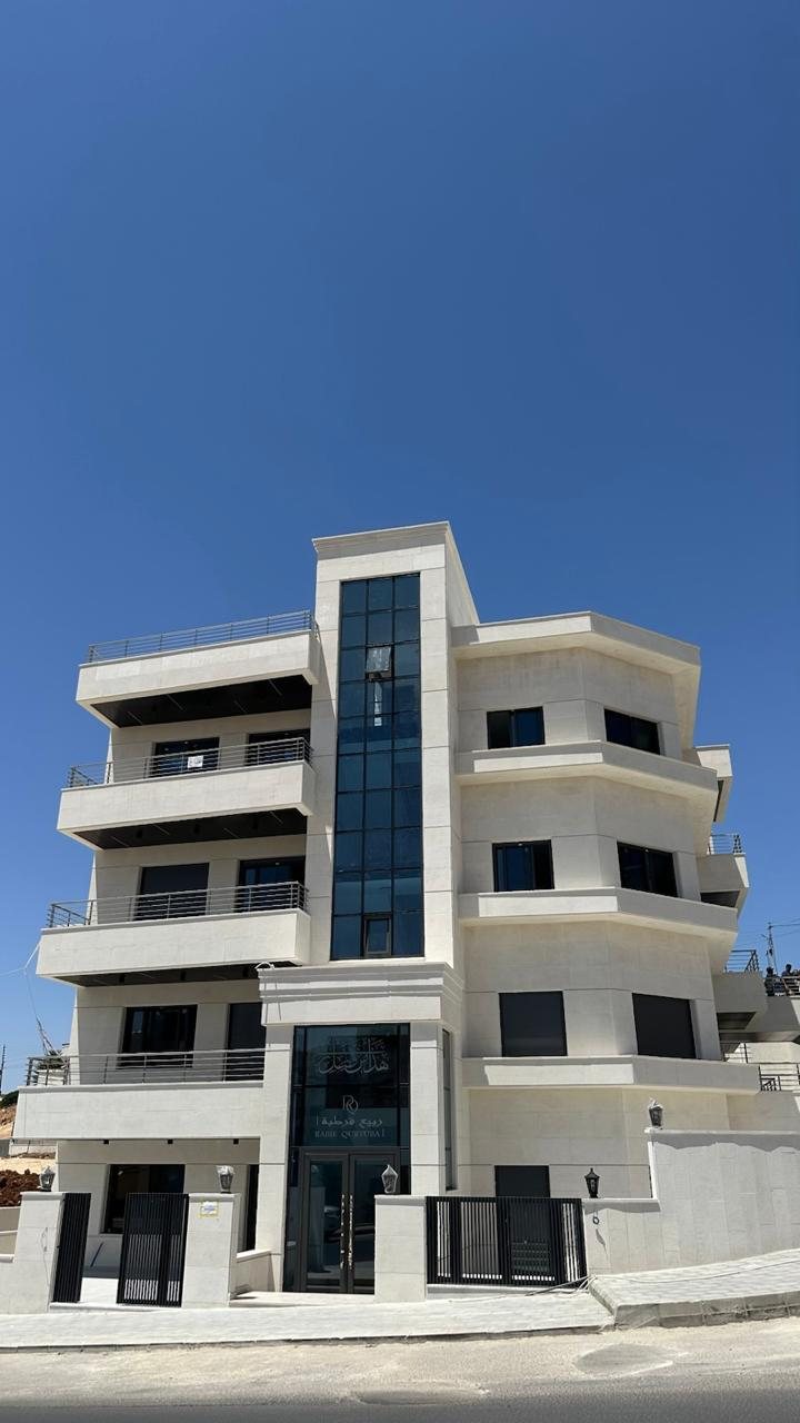 Multi-storey stone-clad building